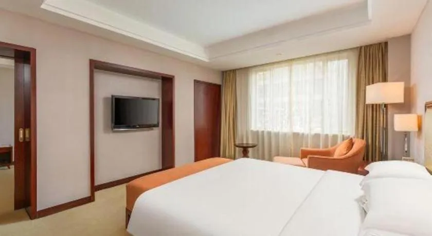 Bed in Maison New Century Hotel Ningbo