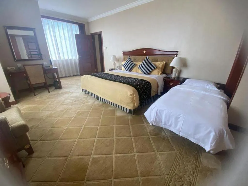 Bed in Xinhai Jinjiang Hotel