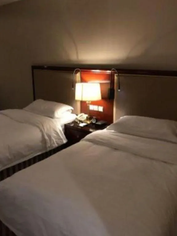 Bed in Xinhai Jinjiang Hotel