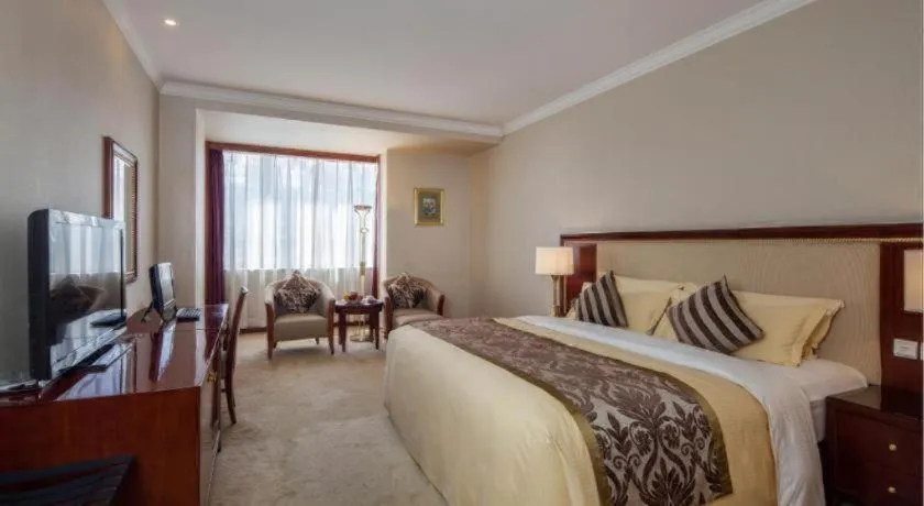 Bed in Xinhai Jinjiang Hotel