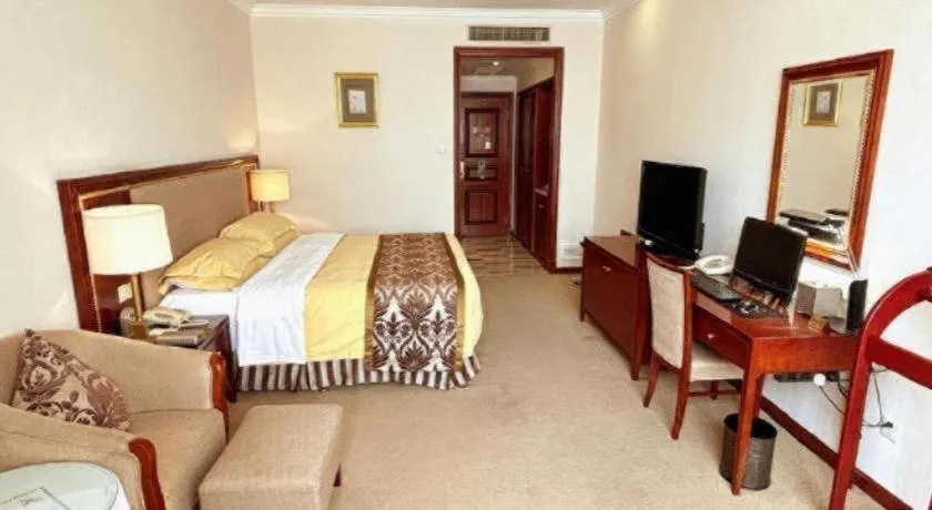 Bed in Xinhai Jinjiang Hotel