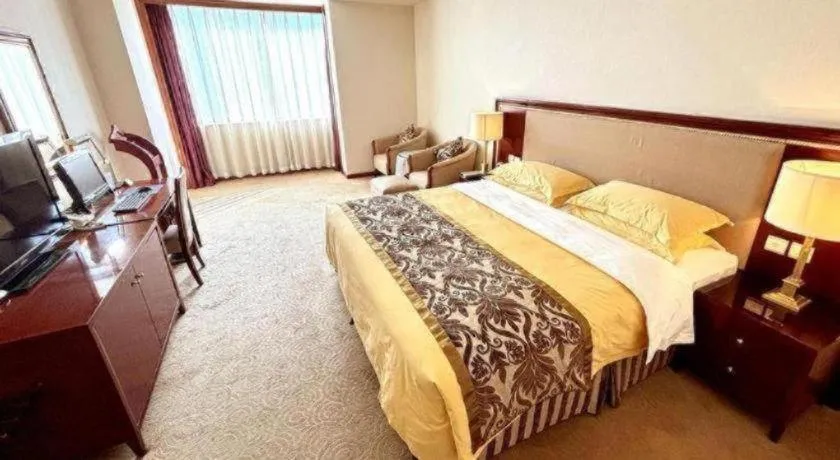 Bed in Xinhai Jinjiang Hotel