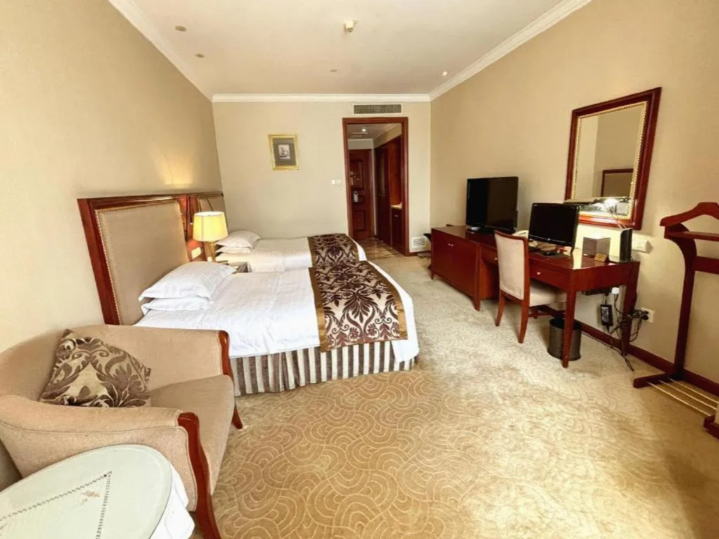 Bed in Xinhai Jinjiang Hotel