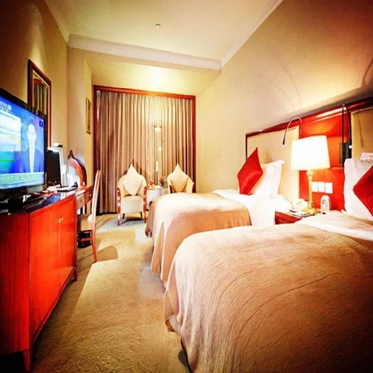 Bed in Xinhai Jinjiang Hotel