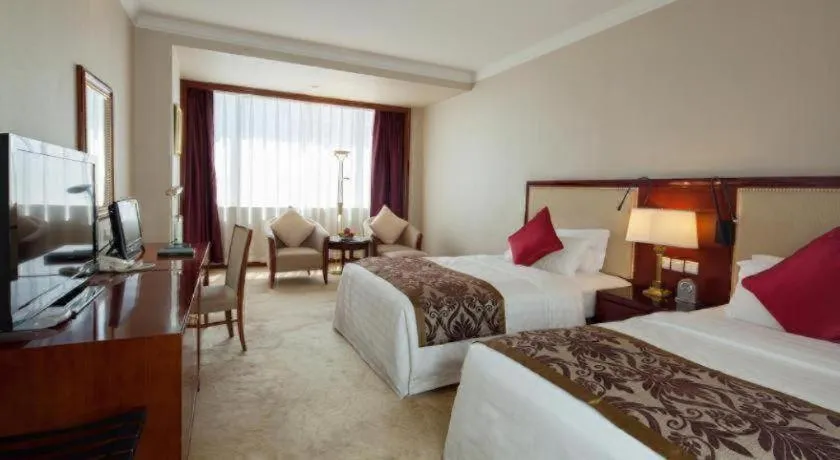 Bed in Xinhai Jinjiang Hotel