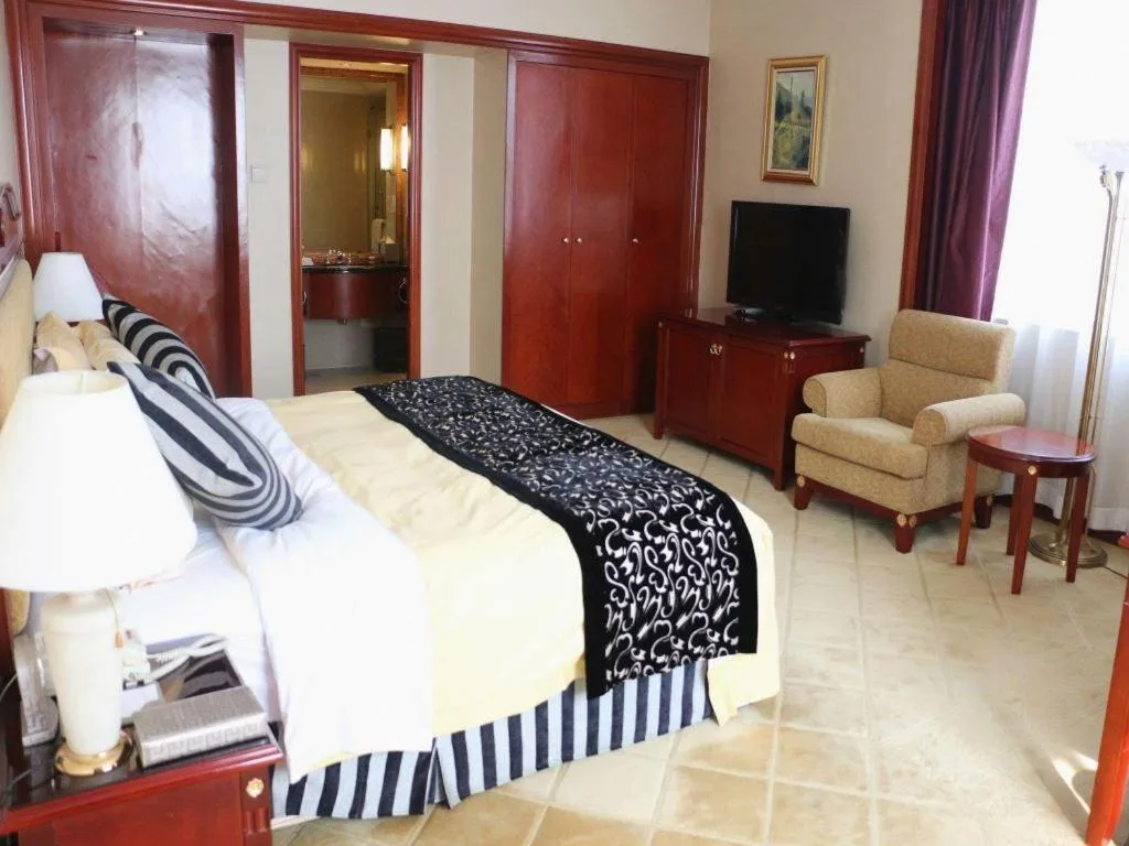 Bed in Xinhai Jinjiang Hotel