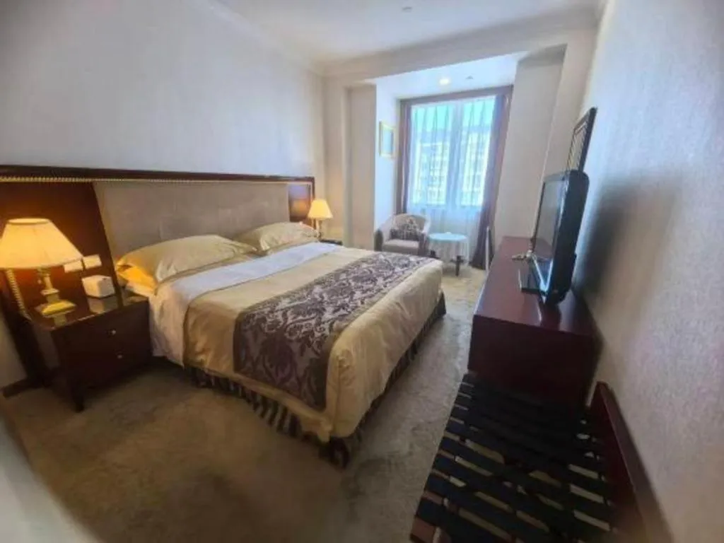 Bed in Xinhai Jinjiang Hotel