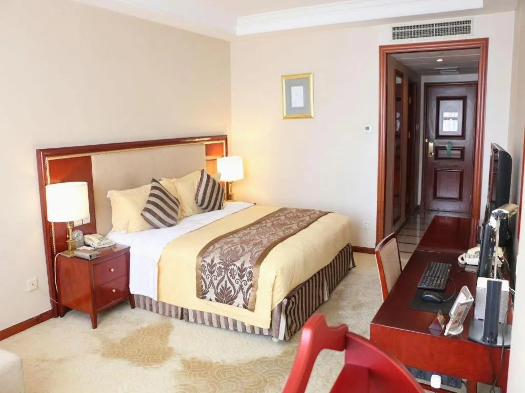 Bed in Xinhai Jinjiang Hotel