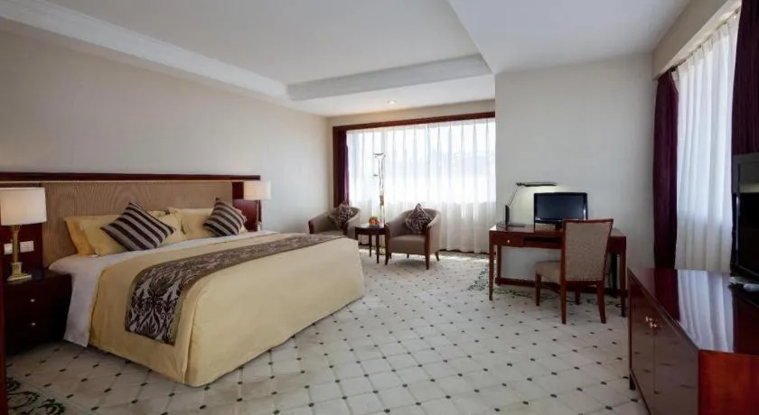 Bed in Xinhai Jinjiang Hotel