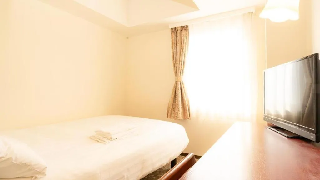 Bed in Smile Hotel Nishiakashi