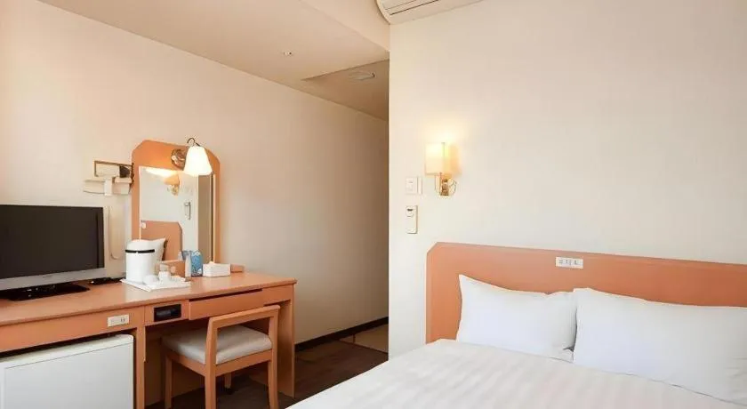 Bed in Smile Hotel Nishiakashi