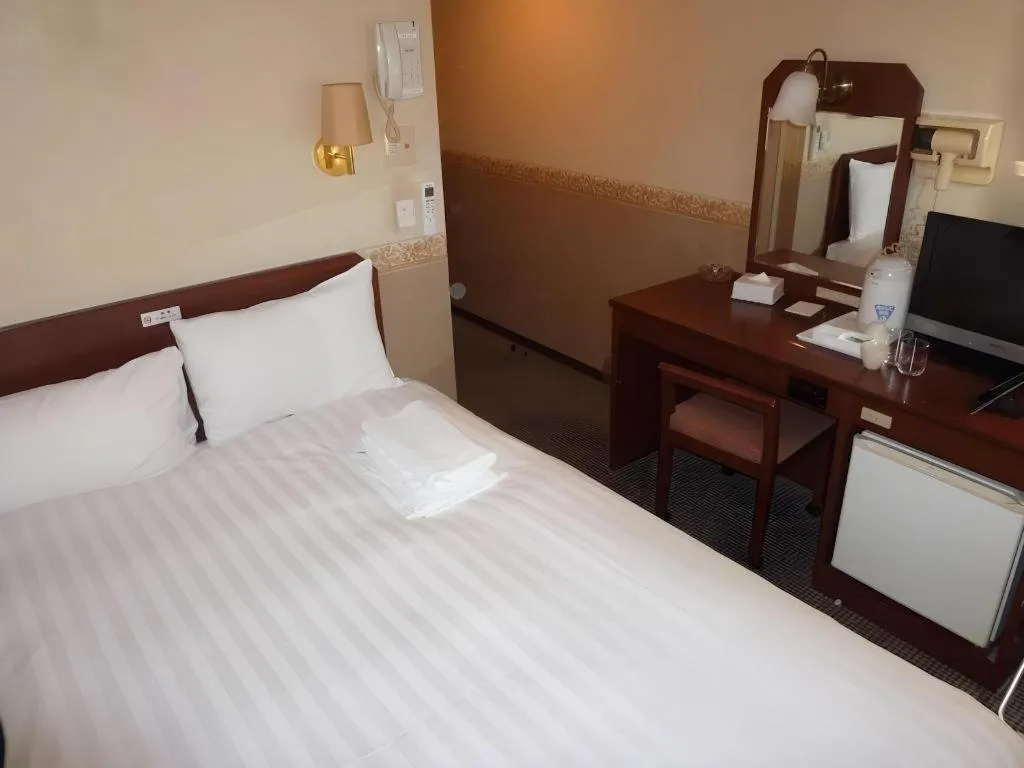 Bed in Smile Hotel Nishiakashi