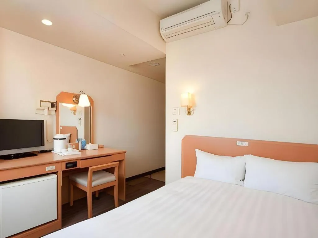 Bed in Smile Hotel Nishiakashi