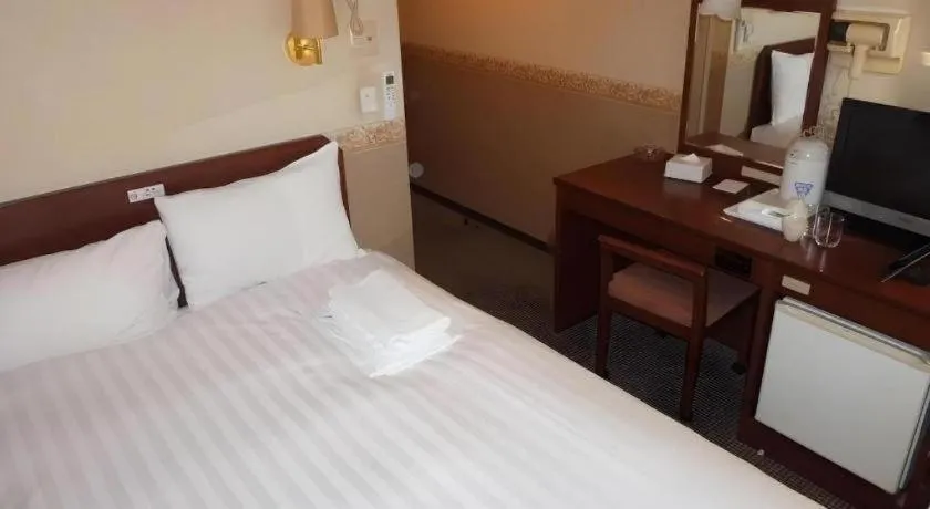 Bed in Smile Hotel Nishiakashi