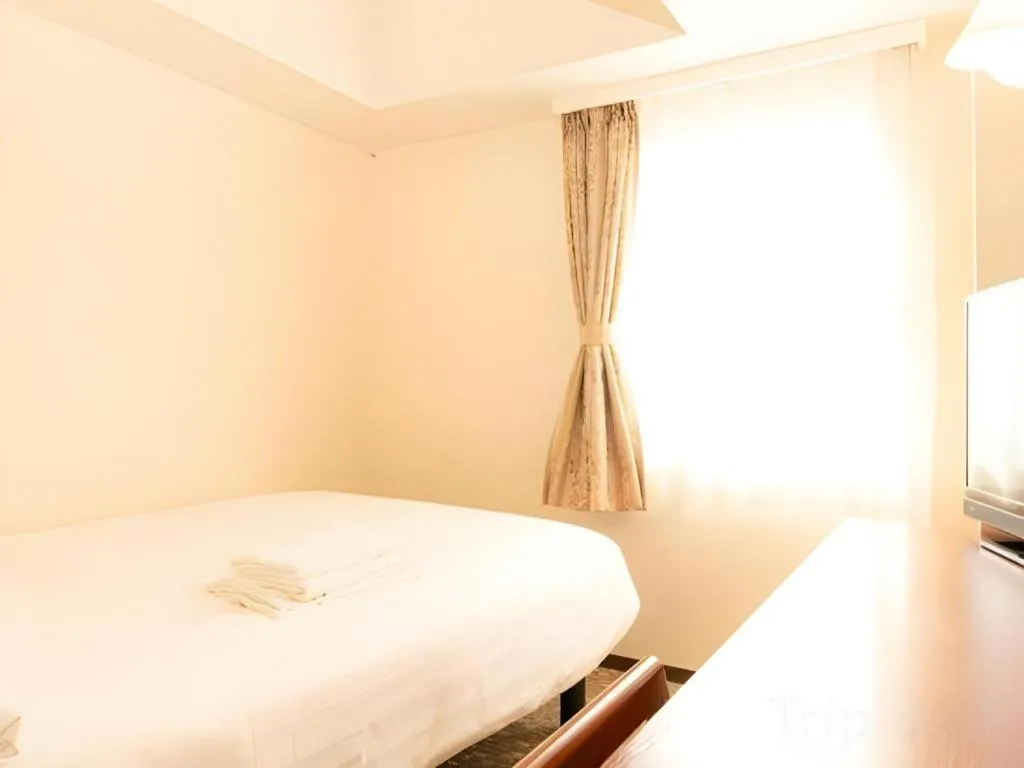 Bed in Smile Hotel Nishiakashi