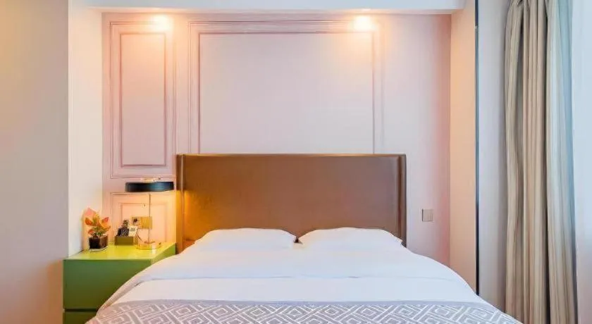 Bed in GME NanJing CaoChanGMEn Nanyihou Stress Hotel