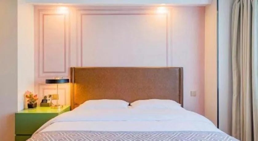 Bed in GME NanJing CaoChanGMEn Nanyihou Stress Hotel