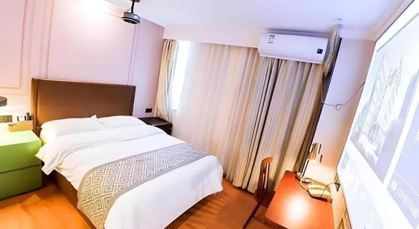 Bed in GME NanJing CaoChanGMEn Nanyihou Stress Hotel