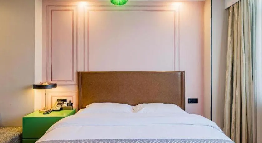 Bed in GME NanJing CaoChanGMEn Nanyihou Stress Hotel