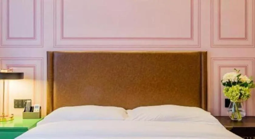 Bed in GME NanJing CaoChanGMEn Nanyihou Stress Hotel