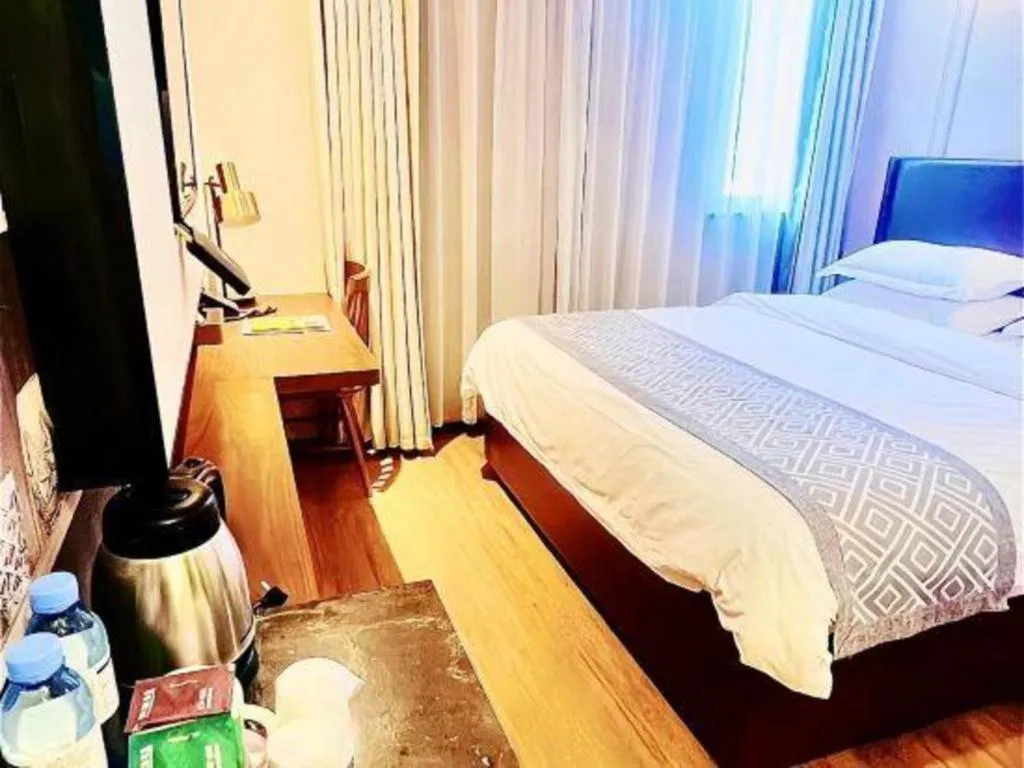 Bed in GME NanJing CaoChanGMEn Nanyihou Stress Hotel