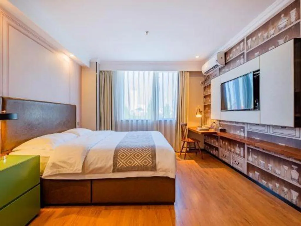 Bed in GME NanJing CaoChanGMEn Nanyihou Stress Hotel