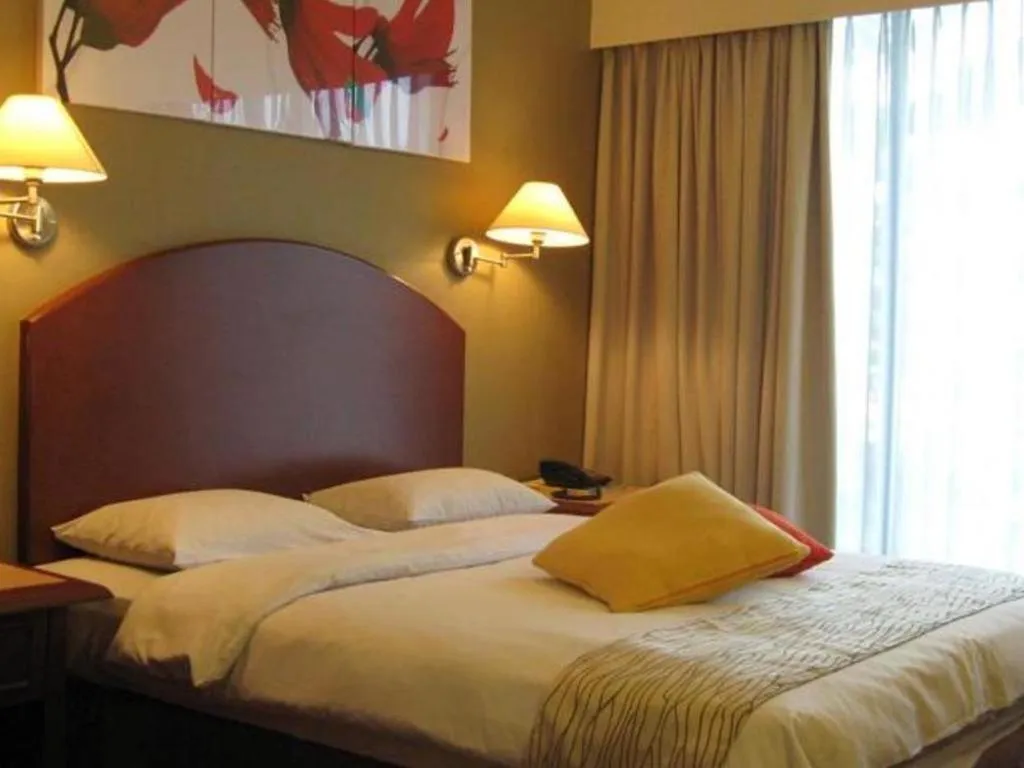 Bed in Casuarina Hotel