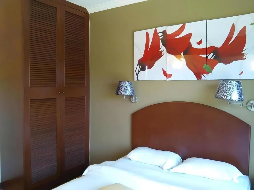 Bed in Casuarina Hotel