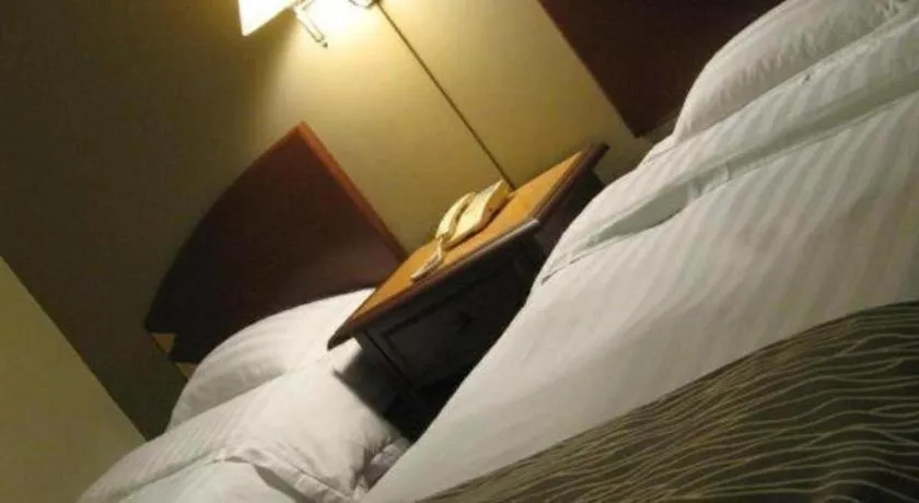 Bed in Casuarina Hotel