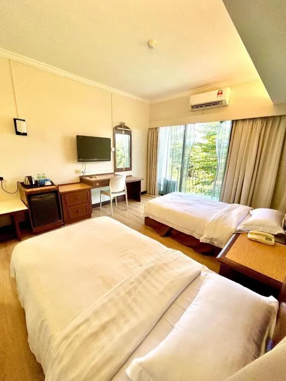Bed in Casuarina Hotel