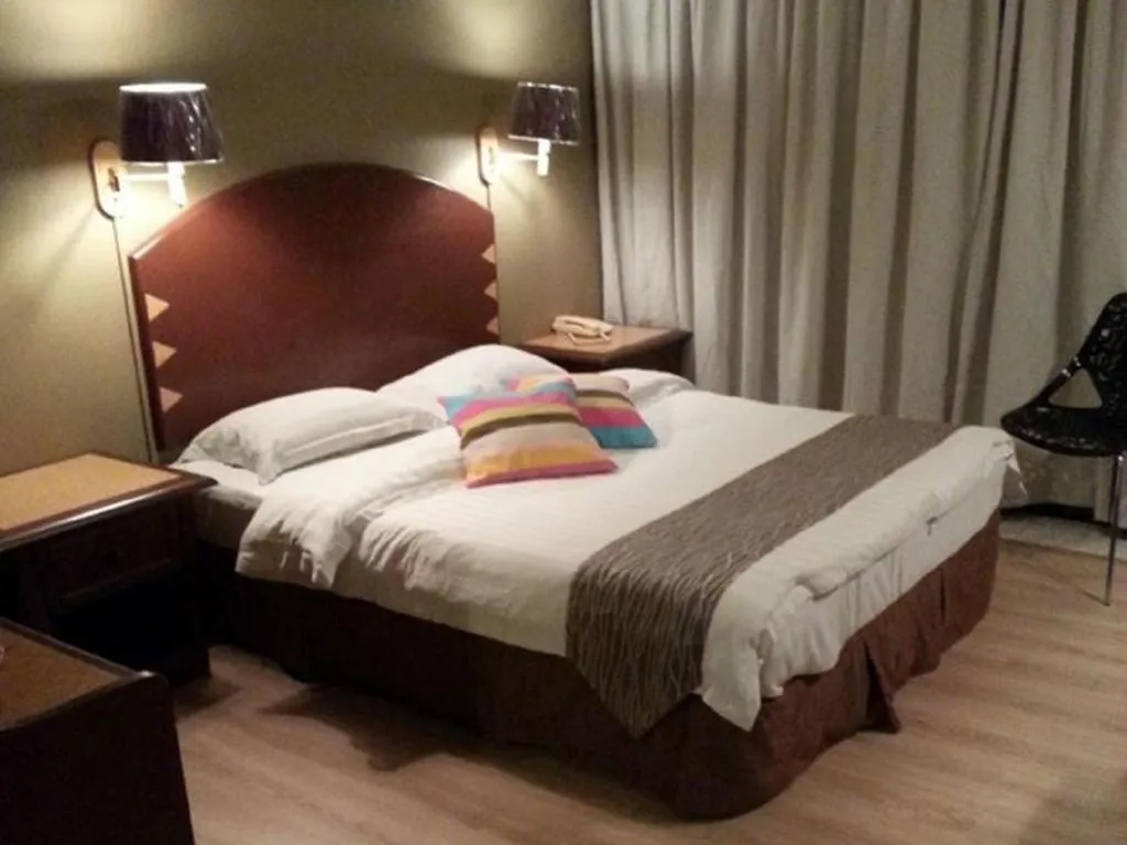 Bed in Casuarina Hotel