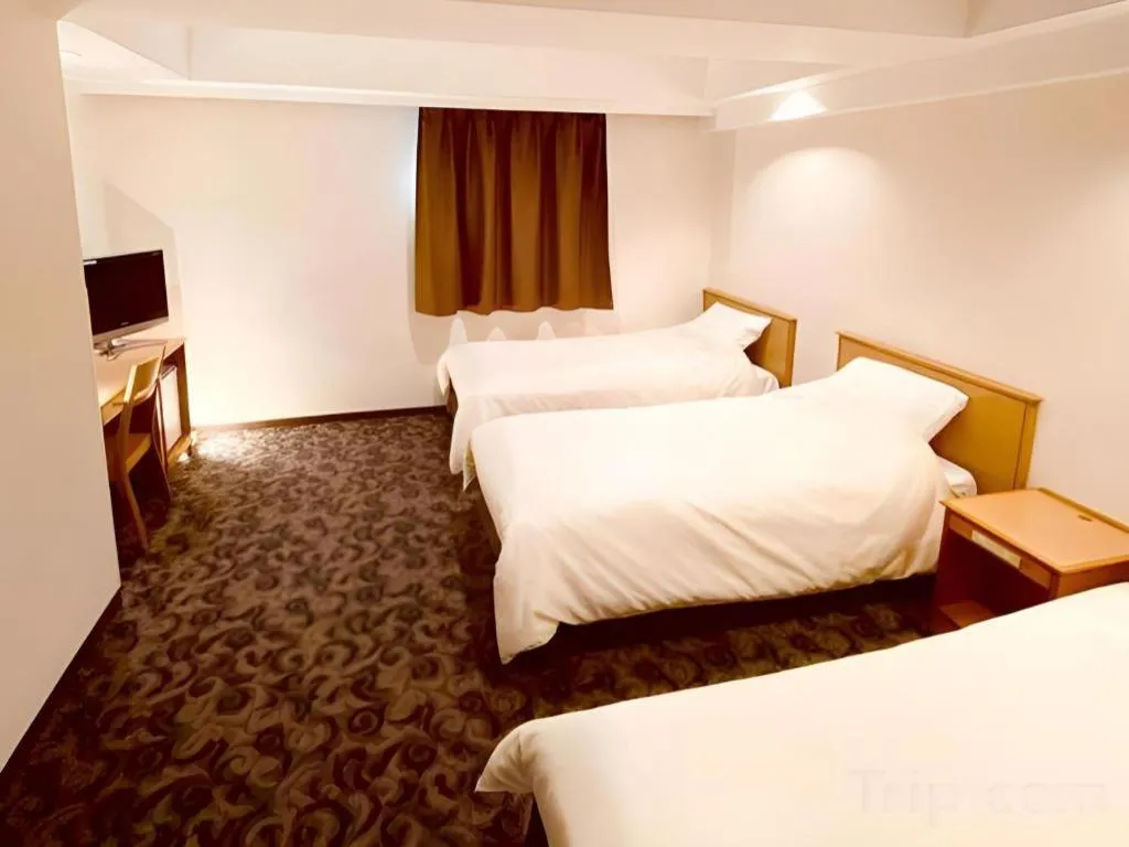 Bed in Nansei Kanko Hotel