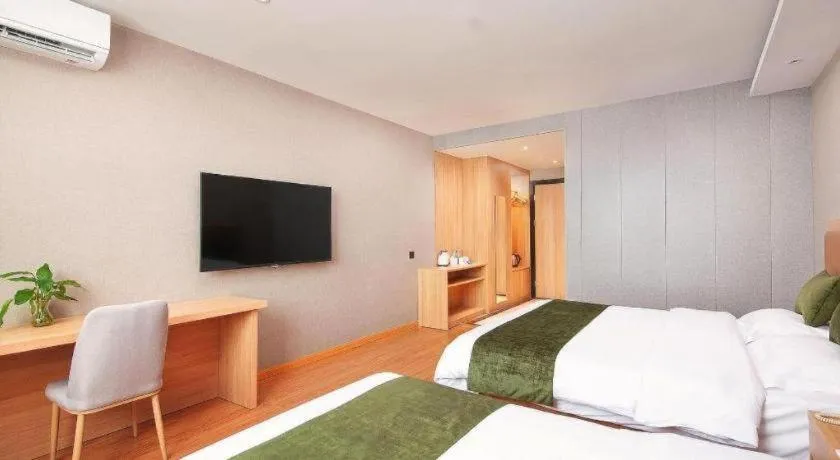 Bed in GreenTree Inn Shanghai Jiading Anting Motor City Express Hotel