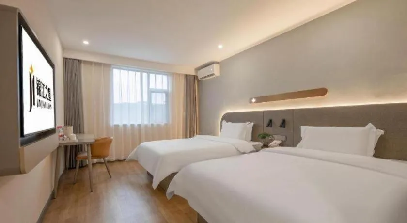 Bed in Jinjiang Inn Hangzhou Lin'an Qianwang Street