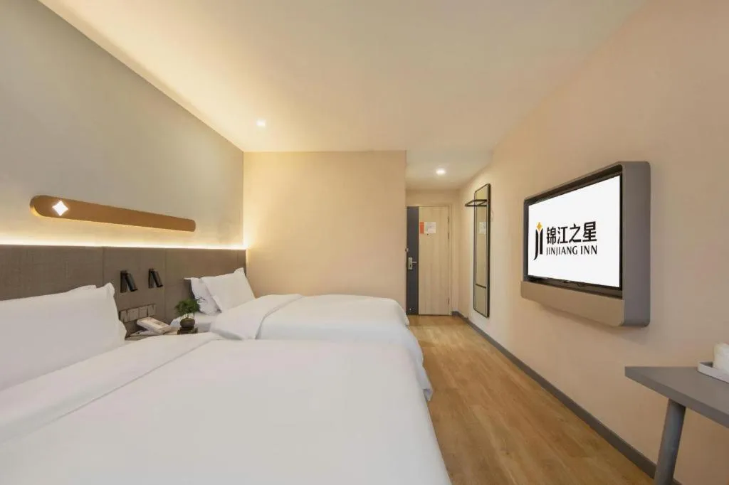 Bed in Jinjiang Inn Hangzhou Lin'an Qianwang Street