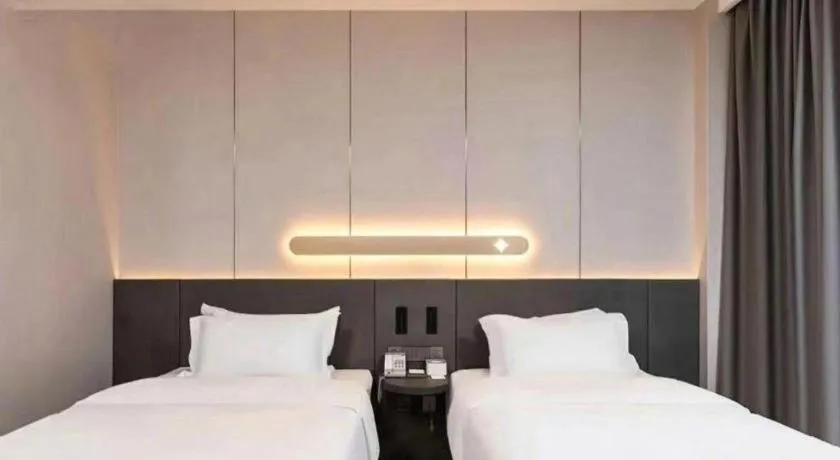 Bed in Jinjiang Inn Hangzhou Lin'an Qianwang Street