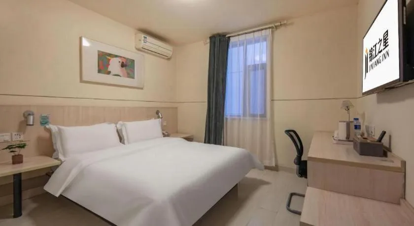 Bed in Jinjiang Inn Hangzhou Lin'an Qianwang Street