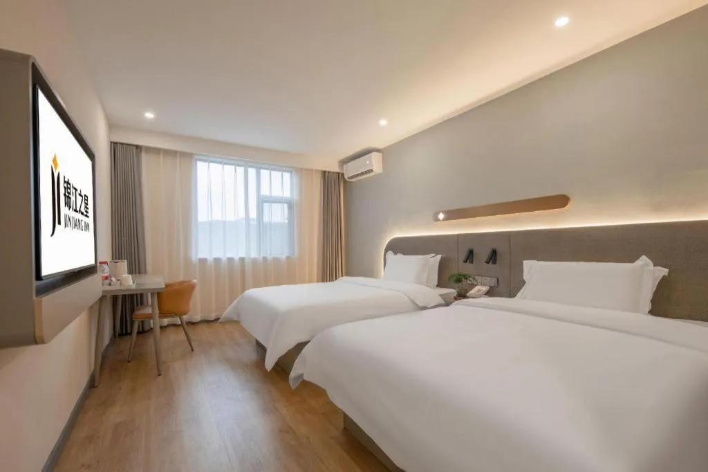 Bed in Jinjiang Inn Hangzhou Lin'an Qianwang Street