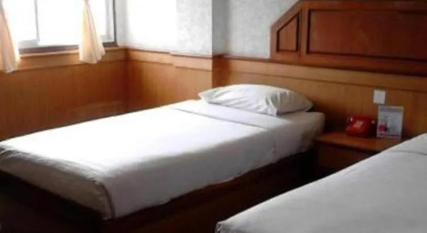 Bed in Sakol Grand Palace Hotel