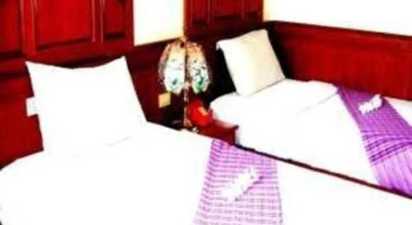 Bed in Sakol Grand Palace Hotel