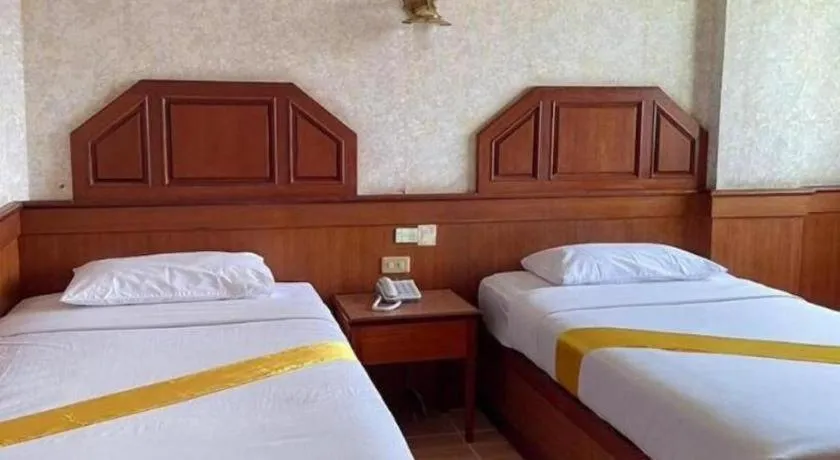Bed in Sakol Grand Palace Hotel