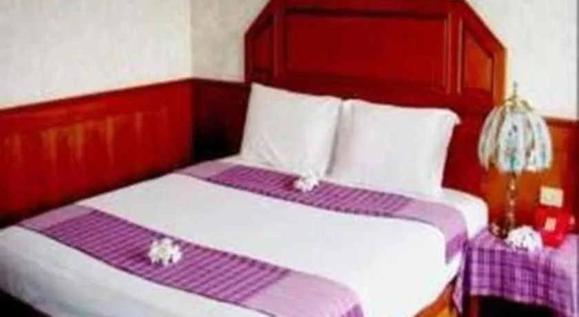 Bed in Sakol Grand Palace Hotel