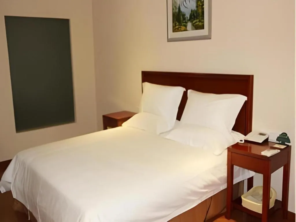 Bed in GreenTree Inn Jiaxing Zhongan Business Hotel