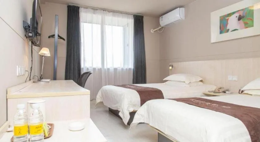 Bed in Jinjiang Inn Zhenjiang Jiangsu University Suning Plaza