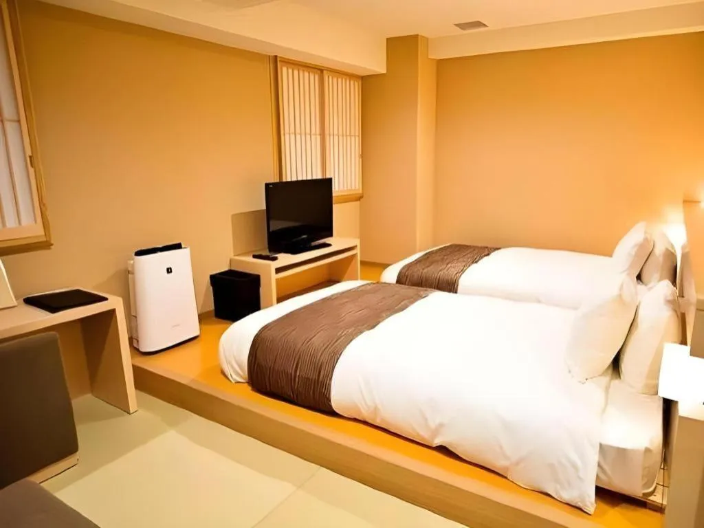 Bed in Spa Land Hotel Naito