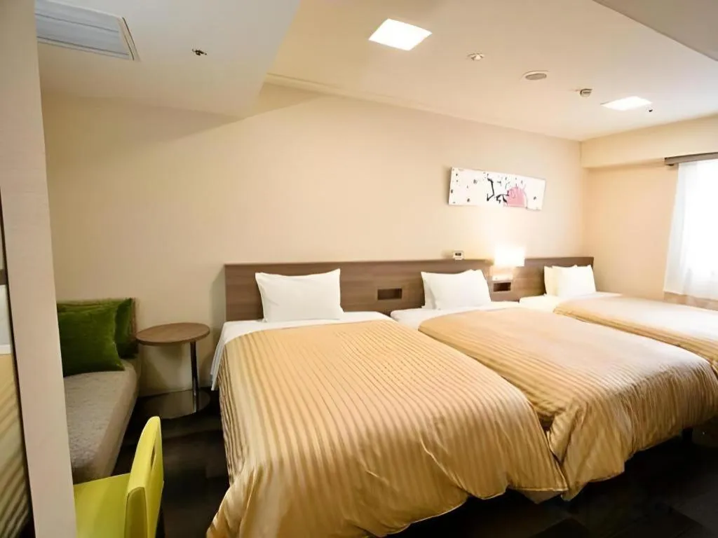 Bed in Spa Land Hotel Naito