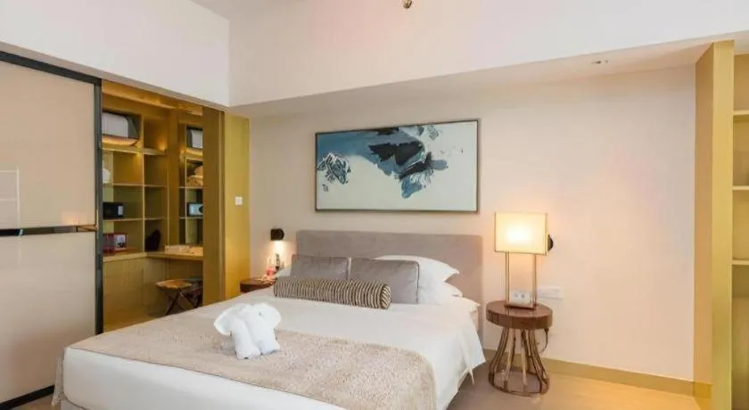 Bed in Huafa Executive Apartment Hotel Zhuhai