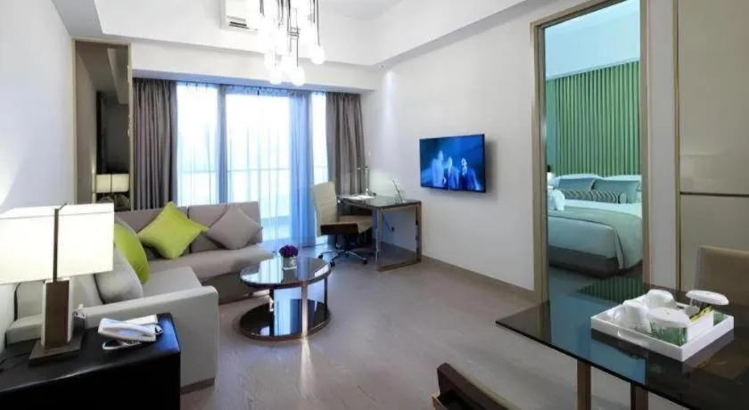 Bed in Huafa Executive Apartment Hotel Zhuhai