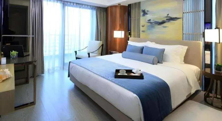 Bed in Huafa Executive Apartment Hotel Zhuhai