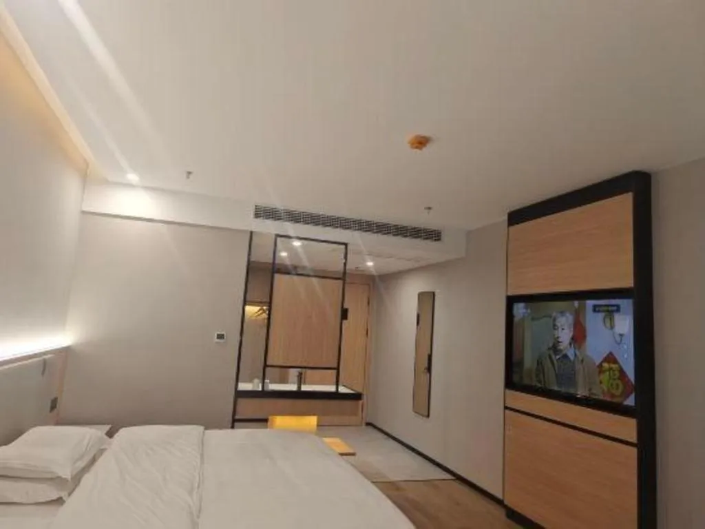 Bed in GreenTree Inn Shanghai Songjiang WanDa Plaza RonGMEi Road Express Hotel